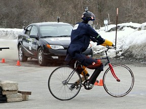 File photo of a crash test simulation involving a moving vehicle and a bicycle from 2013.