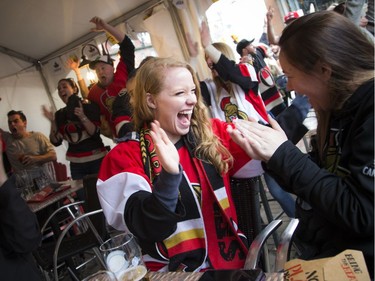 Carley Williamson (centre) reacts as the Senators won against the Bruins Sunday April 23, 2017 at St. Louis Bar and Grill on Elgin along the Sens Mile .   Ashley Fraser/Postmedia