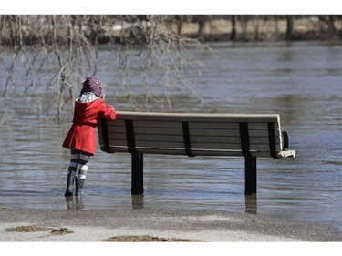 Celina Elzanowska leans on a bench overlooking the Rideau River from Windsor Park.