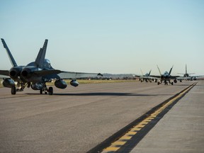 Six Canadian Armed Forces Hornet aircraft take off from Canadian Forces Base (CFB) Bagotville to take part in Operation IMPACT in 2014. Photo: LS Alex Roy, 3 Wing.