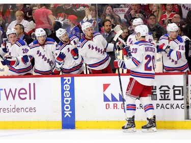 Chris Kreider is congratulated by the Ranger bench for the third goal in the second period.