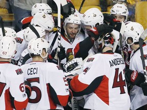 Ottawa Senators' Clarke MacArthur (16) celebrates with teammates after scoring during overtime in game six of a first-round NHL hockey Stanley Cup playoff series against the Boston Bruins, Sunday, April 23, 2017, in Boston. The Senators won 3-2.