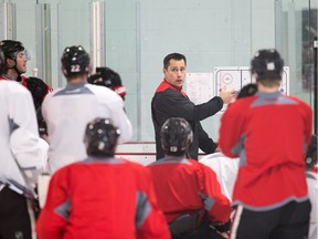 Coach Guy Boucher gives instructions to Senators players during practice at the Bell Sensplex on Friday. The Senators trail the Bruins 1-0 in their best-of-seven series.