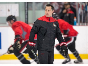 Coach Guy Boucher watches the players skate a drill as the Ottawa Senators practice at the Bell Sensplex in advance of their next NHL playoff game against the Boston Bruins on Saturday. The Bruins are up 1-0 in a best of seven series.