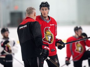 Senators centre chats with associated coach Marc Crawford during Friday's practice session at the Bell Sensplex. Wayne Cuddington/Postmedia