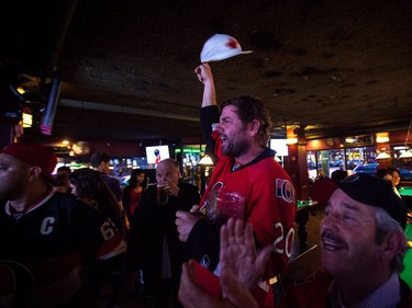 Cory Noel waves his hat at MacLaren's in celebration of the Senators' first-period goal.