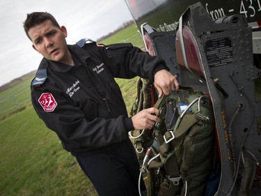 Cpl Marc-André De-Serres goes over the safety gear prior to the Snowbirds media flight out of the Gatineau Airport to fly over Ottawa Saturday April 29, 2017.