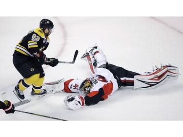 Senators goalie Craig Anderson is down but Brad Marchand fails to get it over him in the first period.