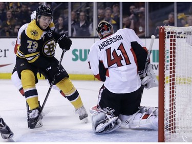Ottawa Senators goalie Craig Anderson (41) makes a save on a shot by Boston Bruins defenceman Charlie McAvoy during the second period.