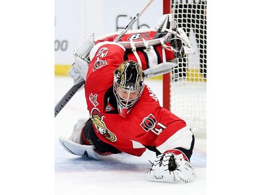 Craig Anderson jumps on the loose puck in the second period.