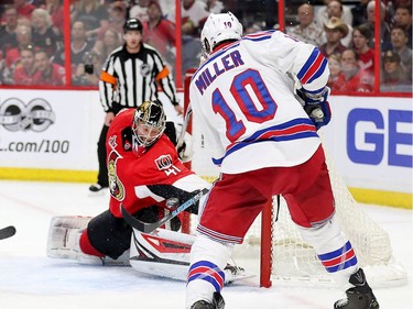 Craig Anderson makes a big stop on J.T. Miller in the second period.