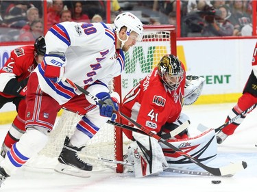 Craig Anderson of the Ottawa Senators makes the save on Michael Grabner.