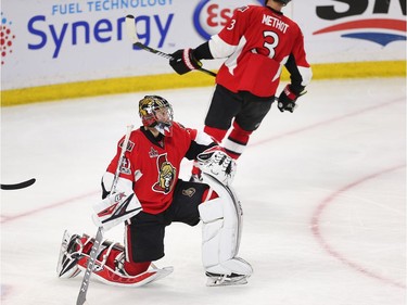 Craig Anderson pauses after the Bruins won the game in the second overtime period.