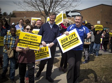 Cyrville Councillor Tim Tierney and Mayor Jim Watson start the community safety march on Jasmine Crescent Sunday April 9, 2017.   Ashley Fraser/Postmedia