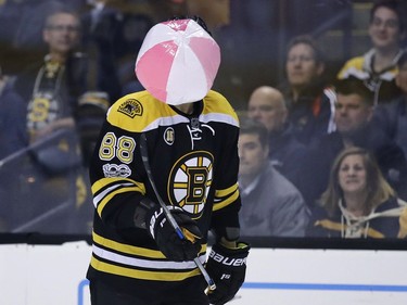 The Boston Bruins' David Pastrnak juggles a beach ball that landed on the ice during the second period.