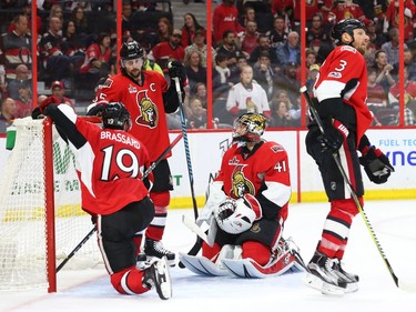 Derick Brassard, left, Erik Karlsson, Craig Anderson and Marc Methot of the Ottawa Senators react after a goal by the Boston Bruins that was eventually disallowed during the first period of overtime.