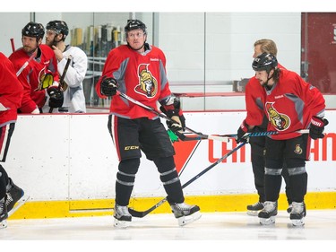 Dion Pahneuf (C) waits for a drill as the Ottawa Senators practice at the Bell Sensplex in advance of their next NHL playoff game against the Boston Bruins on Saturday. The Bruins are up 1-0 in a best of seven series.