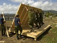 This 2010 photo shows members of the 74 Construction Troop from 4 Engineering Support Regiment building a structure for an orphanage in Haiti. DND photo.