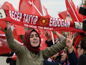 Supporters of Turkish President Recep Tayyip Erdogan await his arrival in Turkey's capital, Ankara, on Monday. Erdogan declared victory in Sunday's historic referendum that will grant sweeping powers to the presidency.
