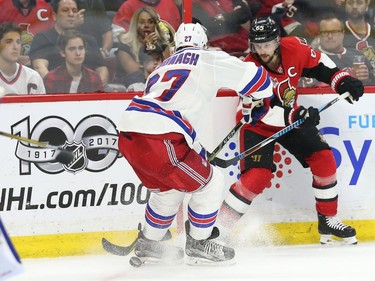 Erik Karlsson of the Ottawa Senators scores on Henrik Lundqvist of the New York Rangers as Tommy Wingels celebrates the goal during third period of NHL playoff action at the Canadian Tire Centre in Ottawa, April 27, 2017. Photo by Jean Levac  ORG XMIT: 126474