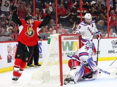 Erik Karlsson of the Ottawa Senators scores on Henrik Lundqvist of the New York Rangers as Tommy Wingels celebrates the goal during third period of NHL playoff action at the Canadian Tire Centre in Ottawa, April 27, 2017. Photo by Jean Levac  ORG XMIT: 126474