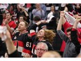 Fans celebrate the Sens' tying goal in the third period.