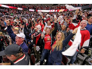 Fans celebrate the tying goal in the third period.