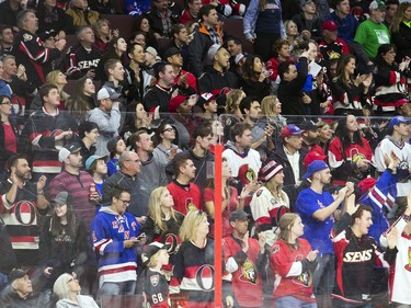 Fans react during the first period of play as the Sens host the New York Rangers on April 8, 2017.