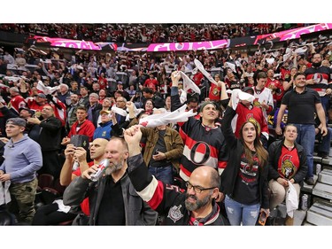 Fans wave their rally towels after the Senators' Bobby Ryan scores in the second period.