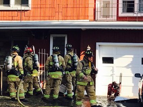 Fire crew outside 511 Neighbourhood Way early Saturday.