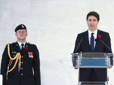 Canadian Prime Minister Justin Trudeau (R) delivers a speech during a commemoration ceremony at the Canadian National Vimy Memorial in Vimy, near Arras, northern France, on April 9, 2017, marking the 100th anniversary of the Battle of Vimy Ridge, a World War I battle which was a costly victory for Canada, but one that helped shape the former British colony's national identity.  /