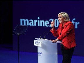 French presidential election candidate for the far-right Front National (FN) party Marine Le Pen delivers a speech during a campaign meeting on April 17, 2017 in Paris. The fight in France is shaping up between far left and far right, writes Andrew Cohen.