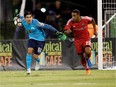 Fury FC's Jamar Dixon (22) keeps an eye on Rowdies goalkeeper Akira Fitzgerald as he puts the ball back into play during Saturday's game game at Al Lang Stadium in Tampa. Matt May Photography, Inc.