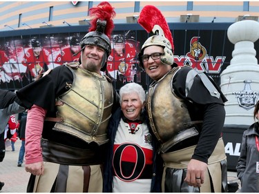 Gladys Siddock of Renfrew poses with Don Kellett, left, and Trevor Bayer in the Red Zone before Game 1 between the Ottawa Senators and the Boston Bruins at the Canadian Tire Centre on Wednesday, April 12, 2017.