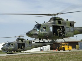 This file photo shows CH 146 Griffons from 408 Tactical Helicopter Squadron taking off on a mission. DND photo.