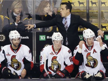 Ottawa Senators head coach Guy Boucher gives instructions during the third period in game six of a first-round NHL hockey Stanley Cup playoff series against the Boston Bruins, Sunday, April 23, 2017, in Boston. The Senators won 3-2 in overtime.