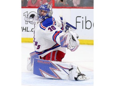 Henrik Lundqvist kicks his toe out to make a stop in the third period.