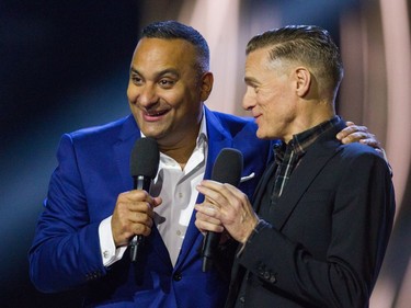 Hosts Russell Peters and Bryan Adams on stage at the Juno Awards held on Sunday at the Canadian Tire Centre.