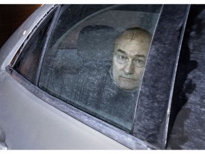 Ian Bush is seen in the back of of an unmarked police cruiser in this 2015 file photo.