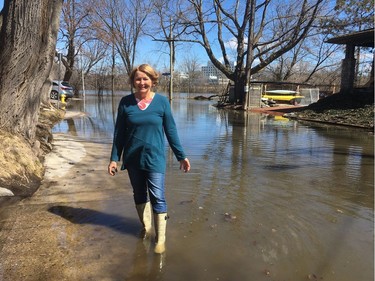 Jean Fleming outside her house on Belmont Avenue in Ottawa South. The street was flooded  when water levels rose in the nearby Rideau River.