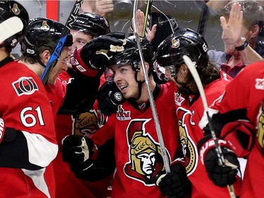 Jean-Gabriel Pageau is congratulated on his game-winning goal on Saturday.