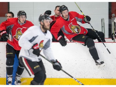 Jean-Gabriel Pageau (L) and Mark Stone jump on the ice as the Ottawa Senators practice at the Bell Sensplex in advance of their next NHL playoff game against the Boston Bruins on Saturday. The Bruins are up 1-0 in a best of seven series.