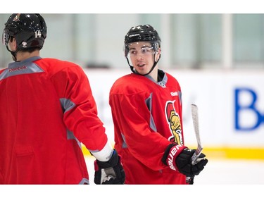 Jean-Gabriel Pageau looks back at Alex Burrows as the Ottawa Senators practice at the Bell Sensplex in advance of their next NHL playoff game against the Boston Bruins on Saturday. The Bruins are up 1-0 in a best of seven series.