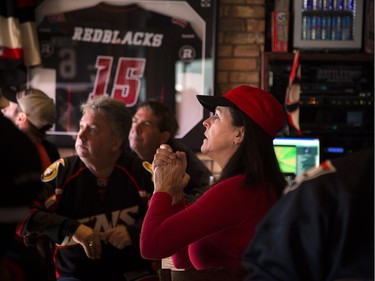 Jo-anne Perras gets right into the game at St. Louis Bar and Grill on Elgin along Sens Mile Sunday April 23, 2017.   Ashley Fraser/Postmedia