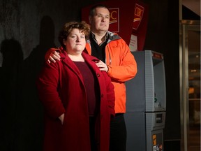 John Jarecsni and Susan Torrie stand beside the ATM where a woman drained their son's bank account.