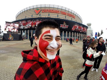 Julian Scheiner has his face painted in the Red Zone.