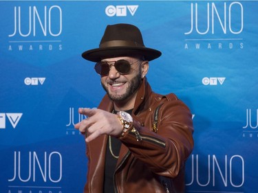Karl Wolf poses on the red carpet as he arrives at the Juno awards show, Sunday, April 2, 2017 in Ottawa.