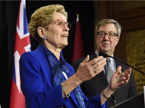 Ontario Premier Kathleen Wynne, left, speaks to the media after meeting Ottawa Mayor Jim Watson in Toronto on Monday, March 6, 2017.