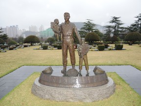 The statue at the UN Memorial Cemetery in Busan honours Canada's sacrifice during the Korean War. Photo by David Pugliese.