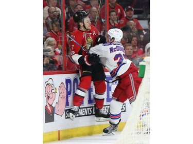 Kyle Turris of the Ottawa Senators is hit hard by Ryan McDonagh of the New York Rangers.